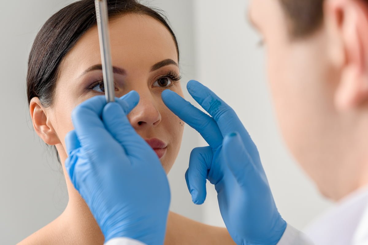 Woman in a Cosmetic Surgery Consultation for Rhinoplasty Revision