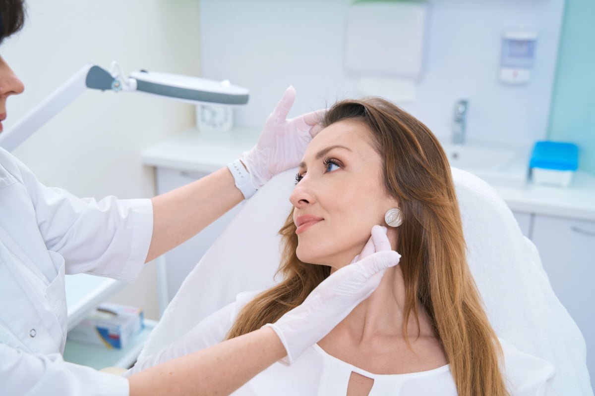 Woman at a deep plane facelift consultation with a board certified cosmetic surgeon