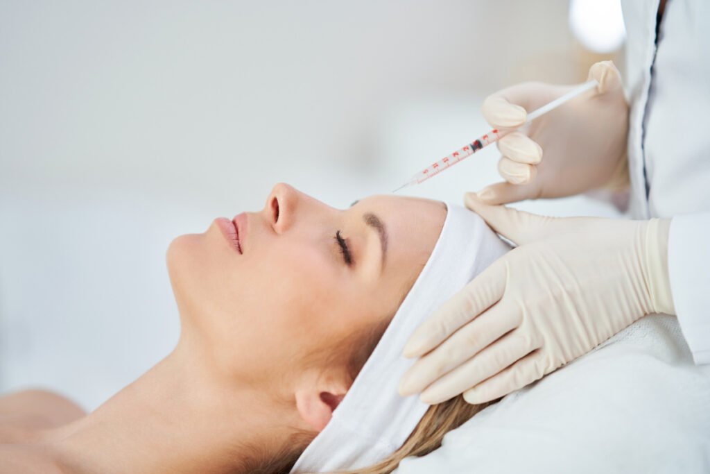 Woman getting new Botox alternative treatment DAXXIFY from board-certified cosmetic surgeon
