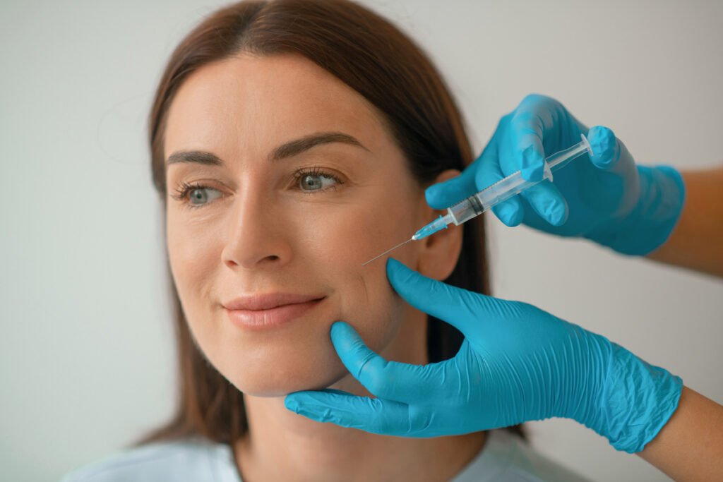 Woman getting facial filler from a board-certified cosmetic surgeon