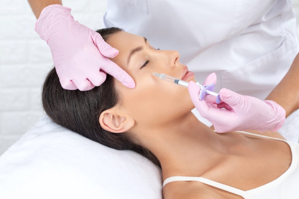 Woman getting dermal filler treatment for under-eye rejuvenation