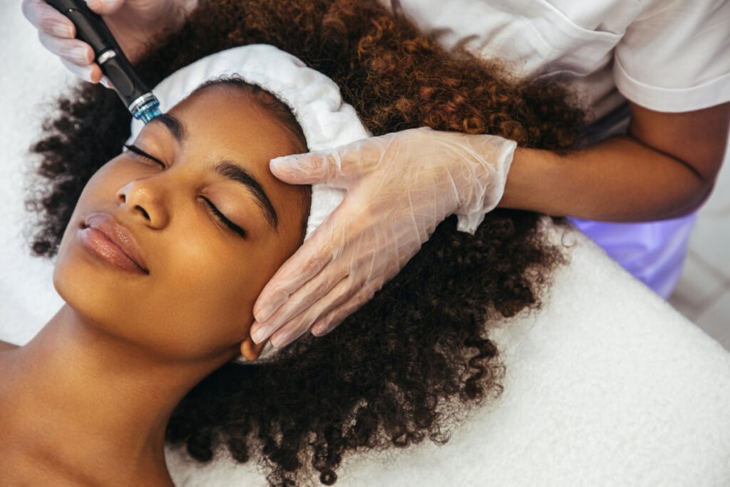 African-American woman getting a non-surgical skin treatment at a medical spa